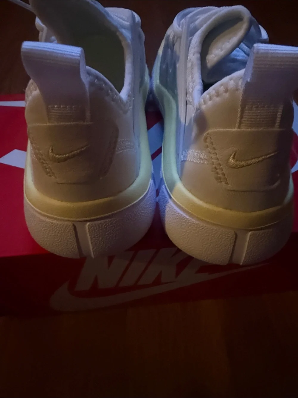 Nike White Athletic Sneakers with Blue Swoosh and Cream Trim
